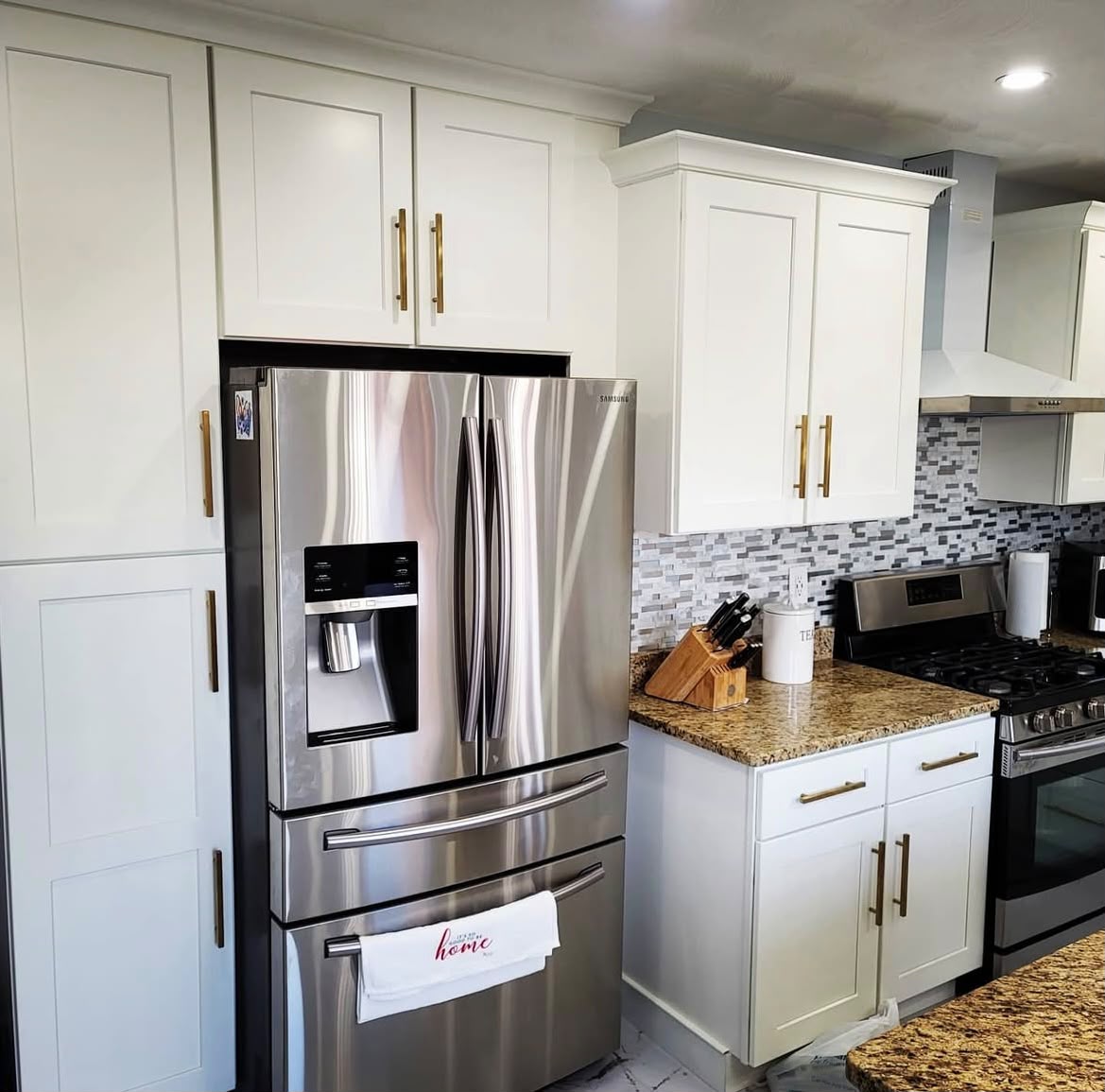 Kitchen cabinetry with brass hardware