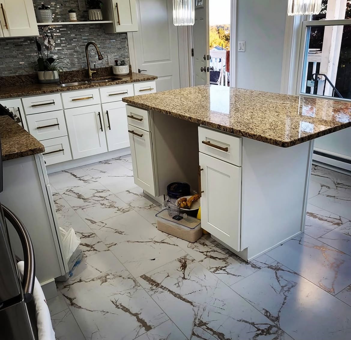 Custom white kitchen with granite island by Hamlet F Construction
